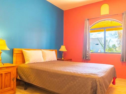 a bedroom with a bed and a window at 2BR 2BA Family Vacation Home with WiFi in San Felipe