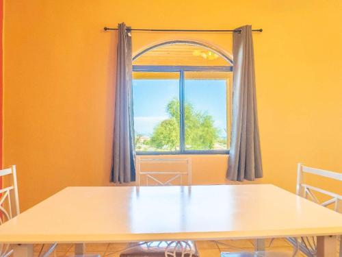 a dining room with a table and a window at 2BR 2BA Family Vacation Home with WiFi in San Felipe