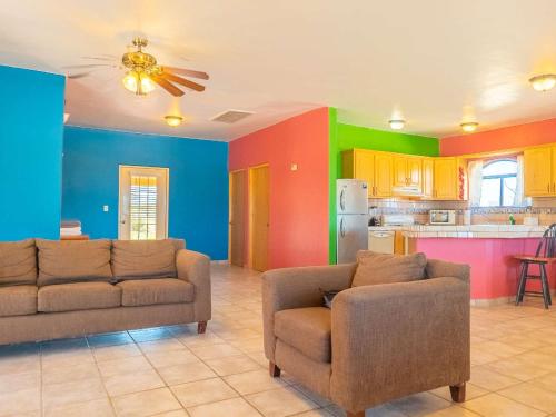 a living room with two couches and a kitchen at 2BR 2BA Family Vacation Home with WiFi in San Felipe