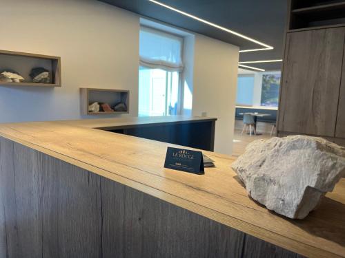 a counter top with a rock on top of it at Le Rocce Val di Non - Quality Room & Breakfast in Tassullo