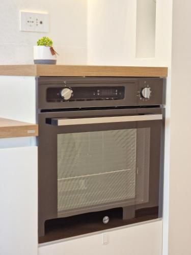a oven in a kitchen with a counter at Maison Danielle in Vico Equense