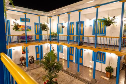 a building with a pool in the middle of it at Hotel Hacienda Santa Clara in Santa Rosa de Cabal