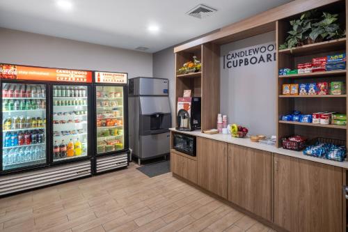a grocery store with a counter and a refrigerator at Candlewood Suites Elkhart, an IHG Hotel in Elkhart