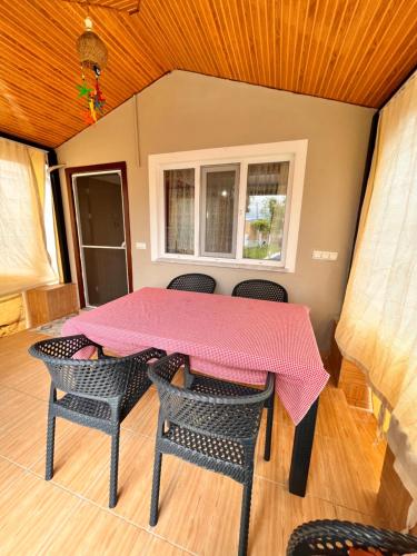 a pink table and chairs in a room at ViLLA DALAMAN - AİRPORT in Dalaman