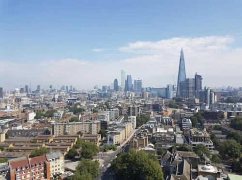 an aerial view of a city with skyscrapers at Manhattan Pad in London