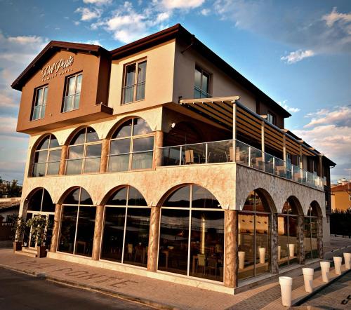 a building with a store front with glass windows at Del Ponte in Svilengrad