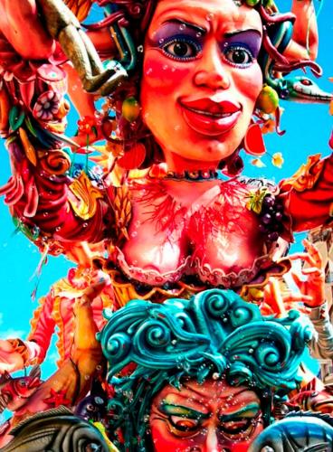 a painting of a woman in a colorful dress at Casa La Conchiglia in Sciacca