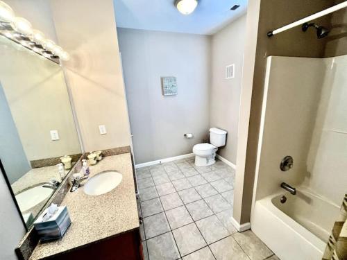 a bathroom with a sink and a shower and a toilet at Beach Block 4 Bedroom with POOL in North Wildwood