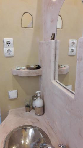 a bathroom with a sink and a mirror at BlauMasnou One step to the beach! in El Masnou