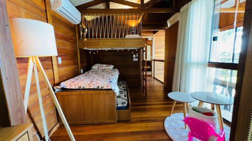 Cama ou camas em um quarto em Ilha do Mel Lodges