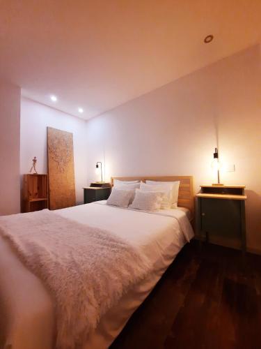 Llit o llits en una habitació de Casa A Júlia In Faro's Heart