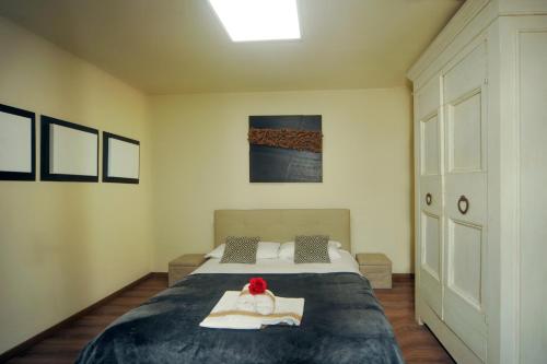 a bedroom with a bed with two dolls on it at Lake View 30 in Sulzano