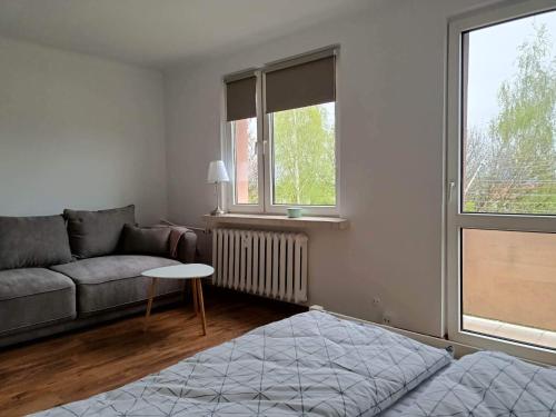 Ένα ή περισσότερα κρεβάτια σε δωμάτιο στο Apartament Żółkiewski