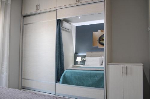 Ένα ή περισσότερα κρεβάτια σε δωμάτιο στο MAXIM APARTMENT