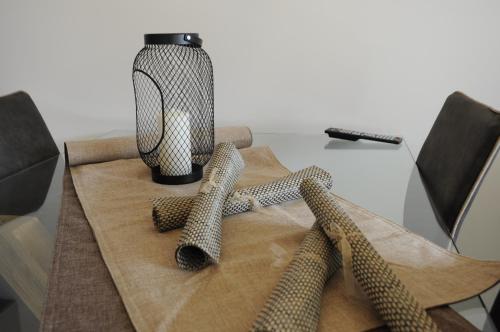 a table with three ties on top of a table at Casa Guarnati Lake View Apartments in Malcesine