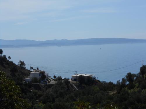 a view of the ocean from the top of a hill at Nikos Place in Agia Galini