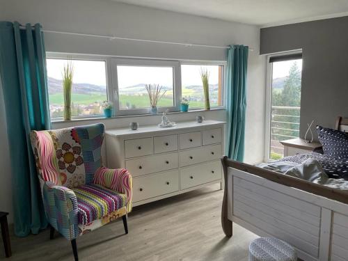 a bedroom with a bed and a dresser and a window at Kellys SPA in Kdyně