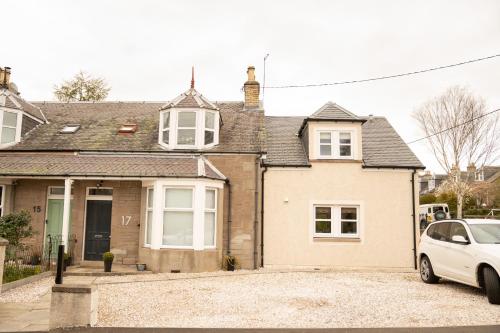 a white car parked in front of a house at 4 Private bedroom house with 3 parking spaces free in Perth