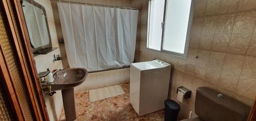 a bathroom with a sink and a toilet and a shower at Casa Andrea Teror in Teror
