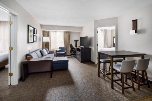 a living room with a couch and a table at Residence Inn Hartford Rocky Hill in Rocky Hill