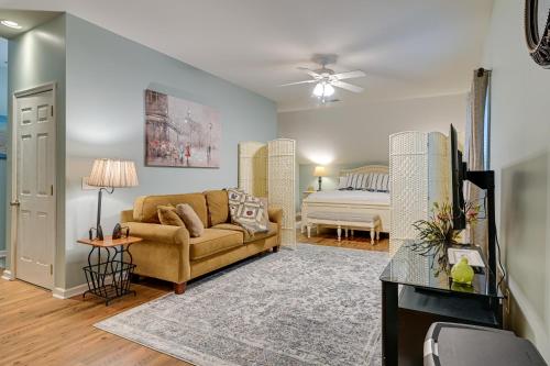 a living room with a couch and a bed at Homey Murrells Inlet Vacation Rental Near Marina in Myrtle Beach