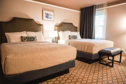 a hotel room with two beds and a window at Columbia Gorge Hotel & Spa in Hood River