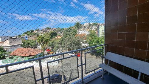 a balcony with a fence and a view of a city at Lindo Apto com VAGA no melhor Ilha do Governador in Rio de Janeiro