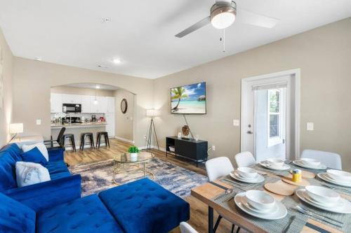 a living room with a blue couch and a table at Luxury 3 Bedroom/2 Bathroom Condo in Melbourne FL with Pool, Gym and Laundry in Melbourne