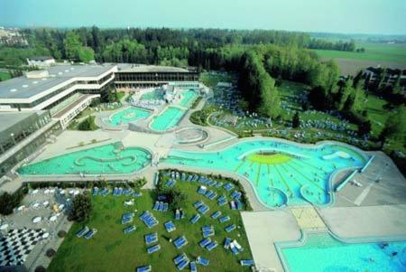 an aerial view of a resort with a swimming pool at Kurhotel Würdinger Hof in Bad Füssing