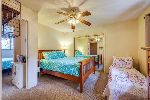 a bedroom with a bed and a ceiling fan at Serene Groveland Cabin Rental Near Yosemite! in Groveland