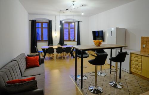 a living room with a couch and a table at Urania KOWARY Apartamenty in Kowary