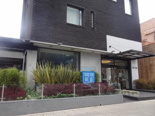 a building with a sign on the front of it at Hotel bh Parque 93 in Bogotá