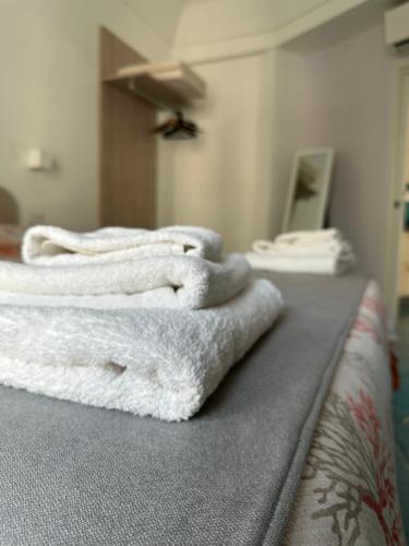 En eller flere senge i et værelse på De Riso Apartments Luxury Amalfi Coast