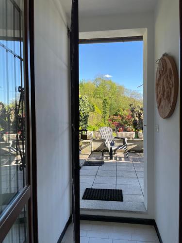 an open door with a view of a patio at Terrazza sul lago in Ameno