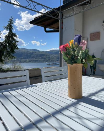 a vase of flowers sitting on a table at Terrazza sul lago in Ameno