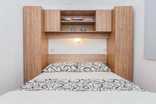 Säng eller sängar i ett rum på Apartments Viljac