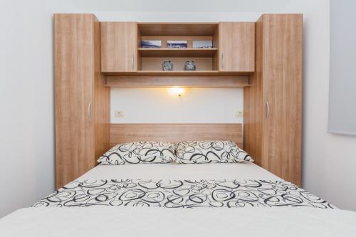 Postel nebo postele na pokoji v ubytování Apartments Viljac