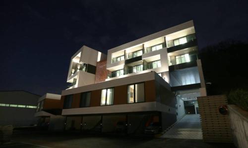 a large building at night with its lights on at Anseong Nomad Hotel in Anseong