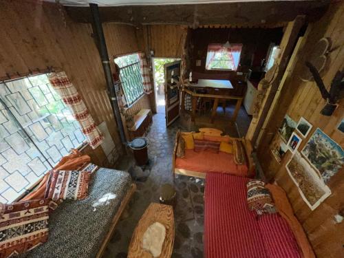 an overhead view of a living room of a house at Cabaña alpina en plena cordillera con acceso a Río in Río Blanco