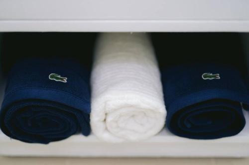 a shelf with three rolls of toilet paper at New York Suite at The Loop at Limketkai in Cagayan de Oro