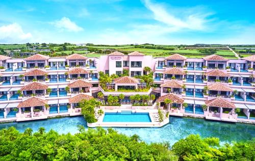 an aerial view of a resort with a swimming pool at Shigira Bayside Suite Allamanda in Miyako-jima