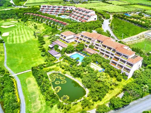 an aerial view of a resort complex with a pond at Shigira Bayside Suite Allamanda in Miyako Island
