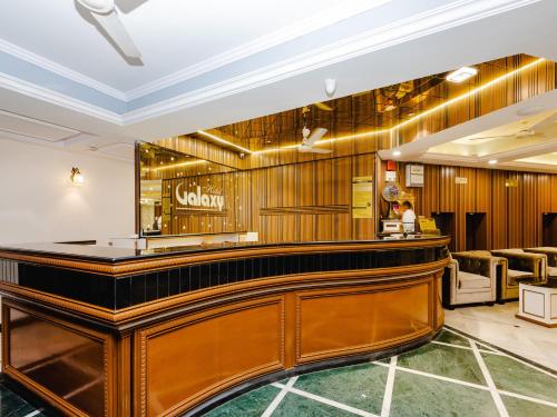 a bar in the lobby of a hotel at Hotel Galaxy Opp Surat Railway Station in Surat