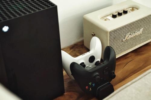 a video game controller sitting next to a speaker at Banyan Villa Panglao with private pool in Panglao