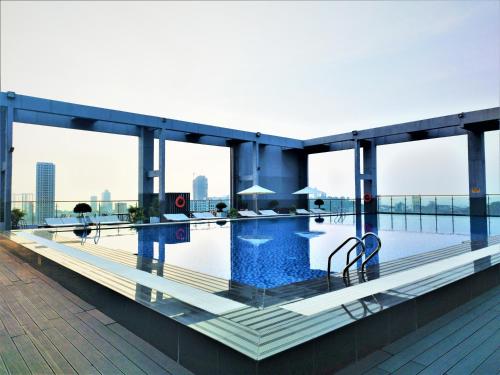 a swimming pool on the roof of a building at Legend Hotel and Resort in Sihanoukville