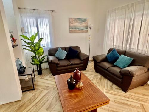 a living room with two couches and a coffee table at Casa Copan in Cancún