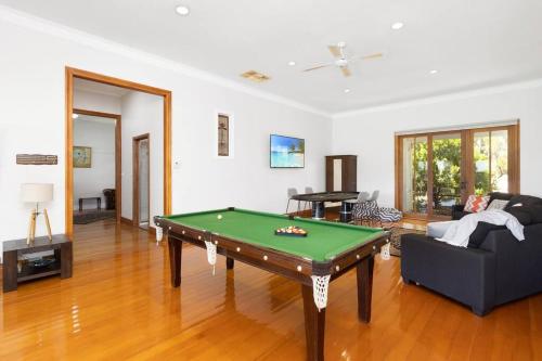 a living room with a pool table in it at Kings Billabong Haven in Irymple
