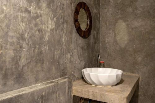 a bathroom with a large white bowl sink on a counter at Secret garden pool villa in Hua Hin