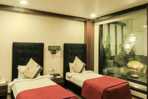 Voodi või voodid majutusasutuse The Nanee Suites toas
