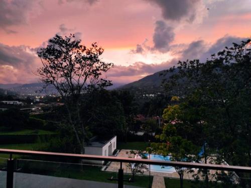 a view of a sunset from the balcony of a house at hermosa casa nueva in Copacabana